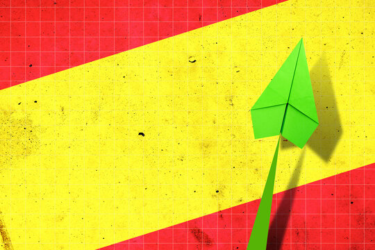 Upward arrow on the background of the flag of Spain. Paper plane. Economic recovery. Copy space. Business.