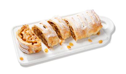 Traditional homemade apple strudel with caramelized apples and raisins. isolated on white background.