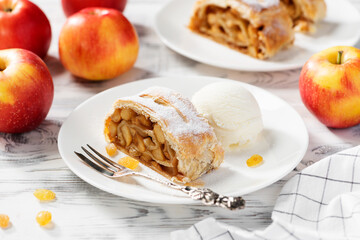 Traditional homemade apple strudel with caramelized apples and raisins.