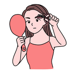 眉カットするキャミソールの女性