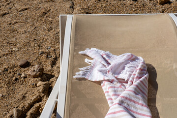 beach towel on sun bed by the beach