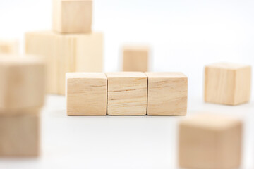 Three blank wooden block cubes on a white background for your text.