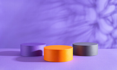 Halloween holiday concept. Podiums or pedestals for products display on purple background.