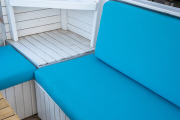 minimal white wooden blue sponge armchair, close up