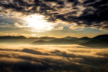 Sunset over fog in the mountains