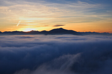 Sunset over fog in the mountains