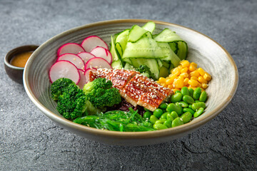 Buddha bowl with smoked eel, green beans, broccoli, corn. Diet healthy nutritious food. Ready menu for the restaurant. Neutral gray blue textured background