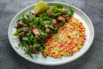 Grilled octopus salad, avocado, tomatoes, sweet peppers. Ready menu for the restaurant. Neutral gray blue textured background