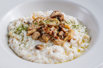 Mushroom risotto in a white bowl
