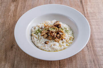 Mushroom risotto in a white bowl