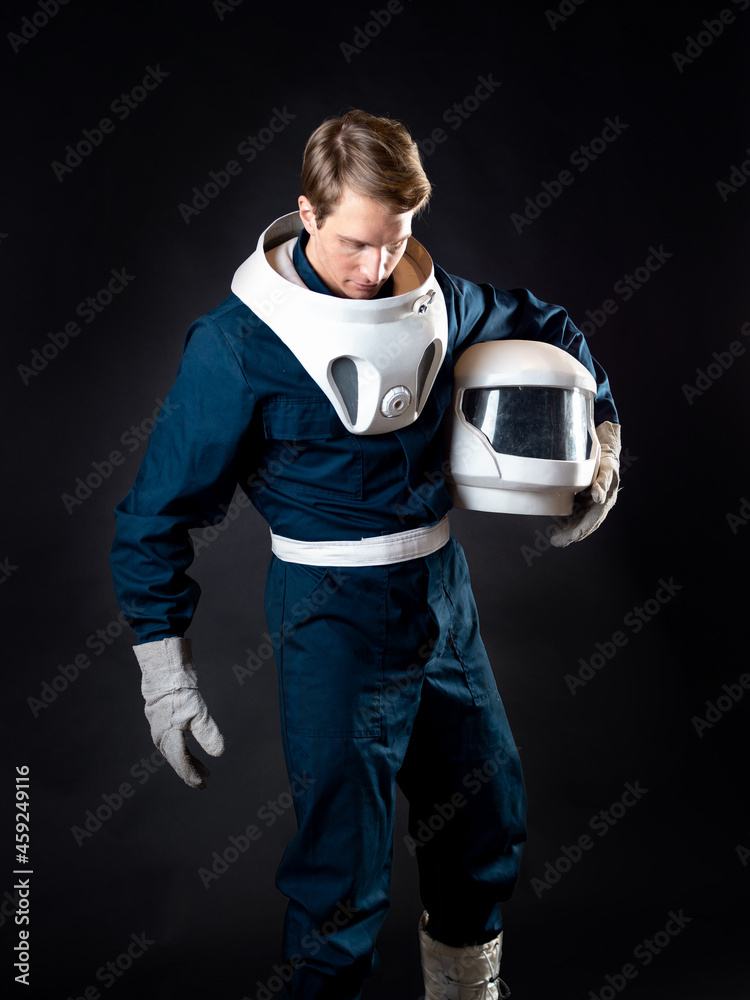 Wall mural an astronaut in a spacesuit is ready for launch.
