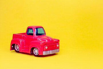 Pink Pickup Toy on yellow background