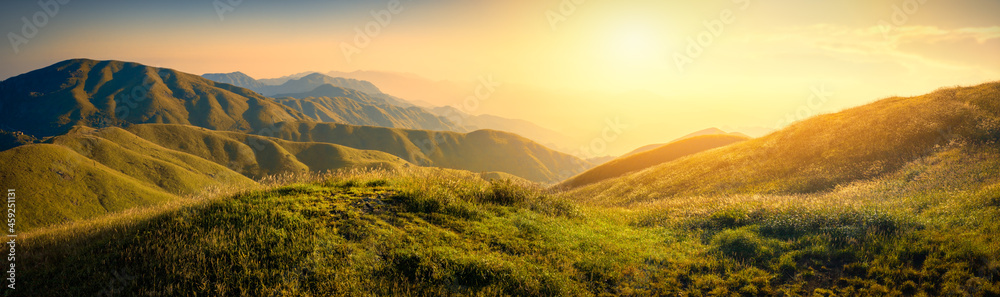 Wall mural Sunset or sunrise in mountain valley.