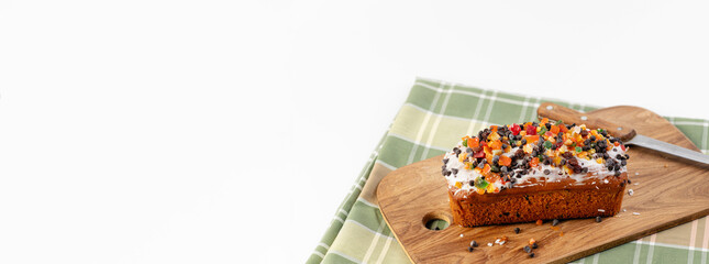 italian christmas cupcake on wooden board, checkered tablecloth and white background, banner, empty space for text