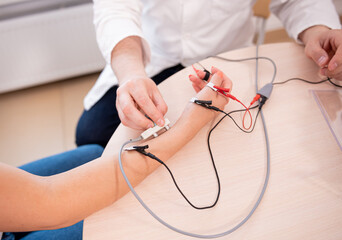 Patient nerves testing using electromyography at medical center - obrazy, fototapety, plakaty