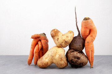 Ugly vegetables, close-up. Concept - Using in cooking imperfect products. Food organic waste reduction