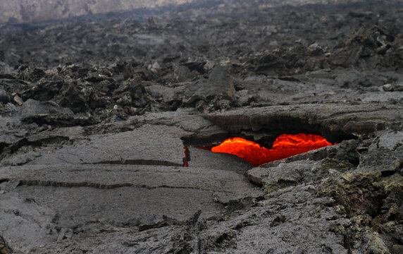 Glimpses of lava through a heart-shaped hole near Iceland's newest volcano, Geldingadalir