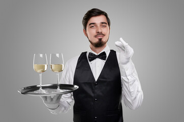 Waiter serving fine wine on tray