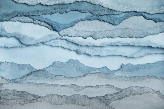 Winter landscape. Abstract texture background. Layers of watercolor painted paper. Torn edges.
