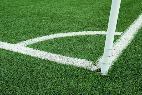 Close up of the corner on a green soccer field
