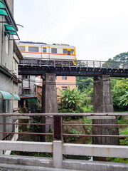 Train of Pingxi Railway Line traveling in Pinghsi old street, New Taipei City, Taiwan