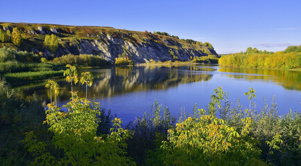 Snow-white gypsum rocks in autumn decoration on Mount Grekhovskaya near the Sylva River