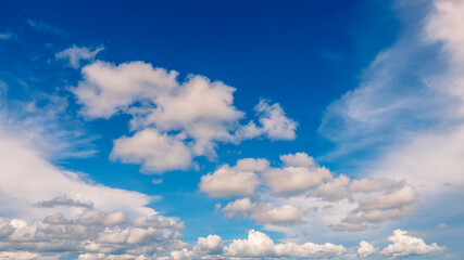 Blue sky fluffy white clouds on summer season bright clear skyline with beautiful cloudscape. Panorama blue sky clouds pattern on daylight with copy space. Cumulus cloudscape air climate sunny day