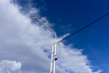 telephone pole under the blue sky