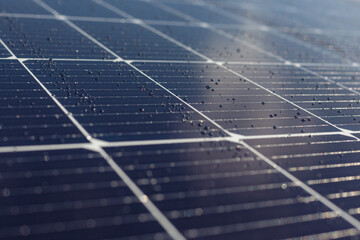 Solar panels blue background, texture. Rain on the solar panel. Blue solar panel electric plate...