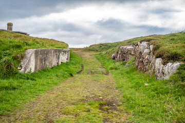 The ruins of Lenan Head fort at the north coast of County Donegal, Ireland.