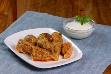 Typical Moldovan and Romanian dish. Cabbage rolls stuffed with meat, rice and vegetables with sour cream. Sarmale.