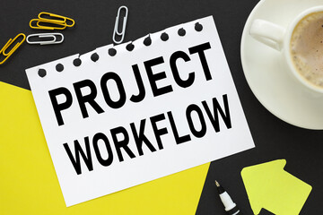 Project Workflow, text on a black background, on white paper, next to bright stickers and a yellow pen
