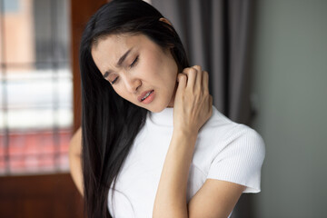 Asian woman scratching her neck skin, concept of dry skin, allergic dermis inflammation, fungus infection, dermatology disease, eczema, rash, skin care