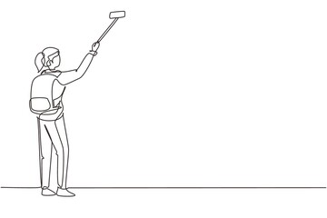 Single continuous line drawing young girl with backpack standing and taking selfie photo on her smart phone. Summer activity at nature. Travel blogger. One line draw graphic design vector illustration