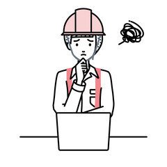 Obraz premium デスクで座ってPCを開いて困っている工事現場の女性