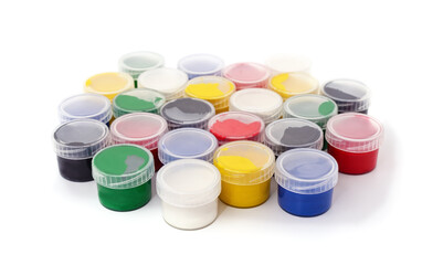 Multicolored gouache paints in containers.