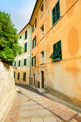 Alley with traditional paint houses. Italy. Liguria. - 459276548