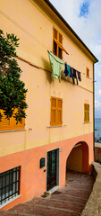 Alley with traditional paint houses. Italy. Liguria. - 459276560