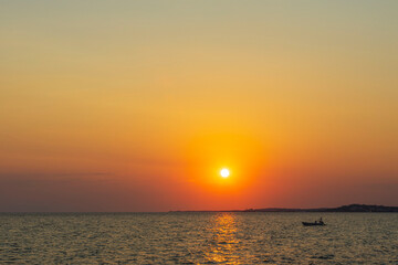 Gorgeous view on sunset on sea on summer day. Sea and sky converging on horizon. Greece.