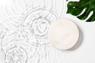 Transparent and clean white water background with podium and sunlight reflection