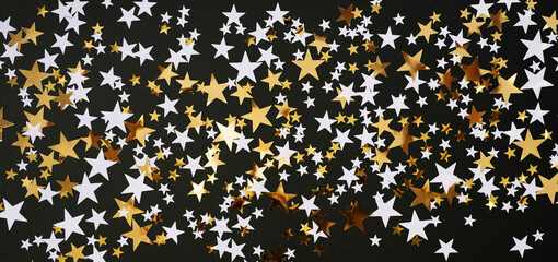 Christmas or birthday stars background, gold and black glow
