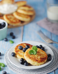 Cottage cheese pancakes - traditional Russian syrniki	