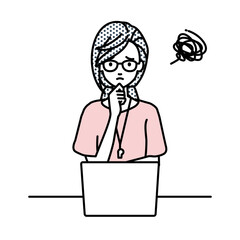 デスクで座ってPCを開いて困っている教師の女性