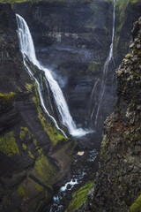 Fototapeta na wymiar Haifoss waterfall in South Iceland in the dusk. Beautiful nature dramatic moody landscape. Vertical view