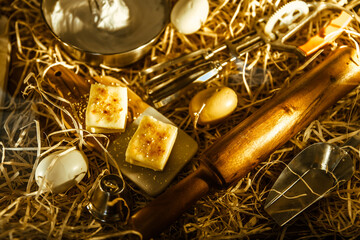 Fototapeta na wymiar Eggs, cheese and wooden rolling pin. Organic products on rustic hay background