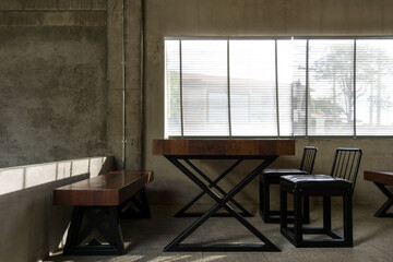 Wooden chair and table near the window and street view in the cafe