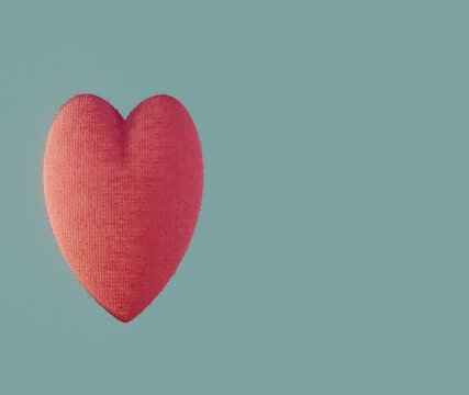 Moving fabric 3D heart in red color. World Heart Day 