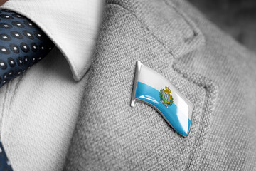 Metal badge with the flag of San Marino on a suit lapel