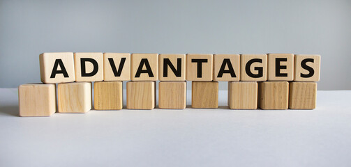 Advantages symbol. Concept word 'advantages' on wooden cubes on a beautiful white background. Business and advantages concept, copy space.