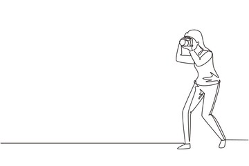 Fototapeta na wymiar Single one line drawing woman photographer taking photo pose. Camera and professional operator, correspondent man. Female with camera making pictures. Continuous line draw design vector illustration